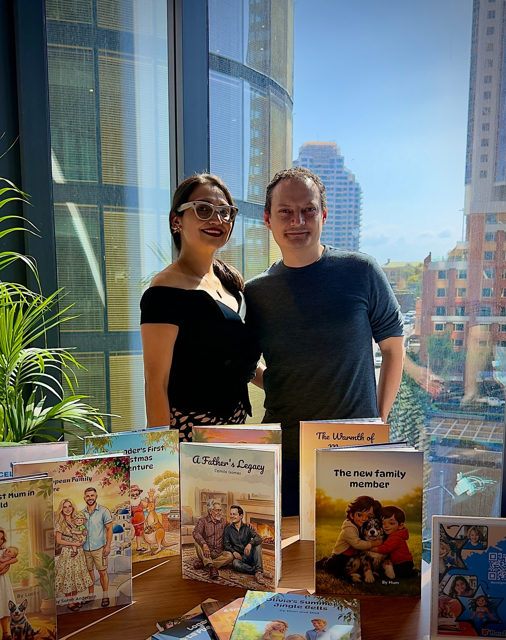 Alba and Camilo, founders of Bandigon, with personalised books made on the platform